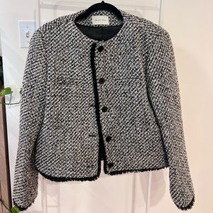 Tweed winter jacket with fuzzy details.